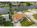 Aerial view of a canal-front home with a large backyard at 4049 Baden Dr, Holiday, FL 34691