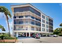 Building exterior with parking and landscaping at 25188 Marion Ave # D101, Punta Gorda, FL 33950