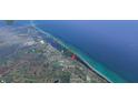 Aerial view showing home's location near water at 1185 Bayshore Dr, Englewood, FL 34223