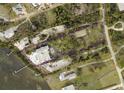 Aerial view of property showing land and tennis court at 1185 Bayshore Dr, Englewood, FL 34223