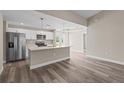 Modern kitchen with island and stainless steel appliances at 1019 Cazenovia St, Port Charlotte, FL 33952
