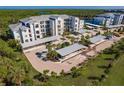 Aerial view of apartment building, showcasing covered parking and landscaping at 14161 Heritage Landing Blvd # 1117, Punta Gorda, FL 33955