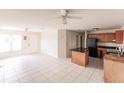 Open concept kitchen with island and dark countertops at 600 Beeche Nw Ter, Port Charlotte, FL 33948