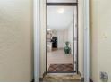 Exterior front door entrance with a screen door at 7457 W Lenox Cir, Punta Gorda, FL 33950