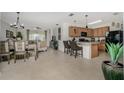 Open kitchen with modern appliances and a breakfast bar at 7457 W Lenox Cir, Punta Gorda, FL 33950