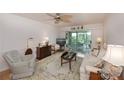 Living room with comfy furniture and access to a balcony at 3251 White Ibis Ct # C4, Punta Gorda, FL 33950