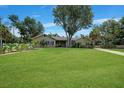 One-story house with landscaping and driveway at 182 Monica St, Port Charlotte, FL 33954