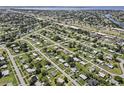 Aerial view showcasing the property's location in a residential neighborhood at 3372 Lucerne Ter, Port Charlotte, FL 33952