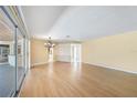 Spacious living area with hardwood floors and a view of the pool at 4041 Michel Tree St, Port Charlotte, FL 33948