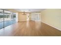 Spacious living area with hardwood floors and a view of the pool at 4041 Michel Tree St, Port Charlotte, FL 33948