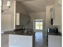 Modern kitchen with granite countertops and stainless steel appliances at 10045 Bay State Dr, Port Charlotte, FL 33981