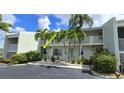 Two-story building exterior with palm trees and parking at 3600 Bal Harbor Blvd # 1-O, Punta Gorda, FL 33950
