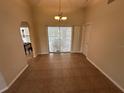 Spacious dining room with tile floors and access to the pool at 23077 Madelyn Ave, Port Charlotte, FL 33954