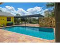 Refreshing pool with terracotta tile decking and a relaxing patio at 24395 Suncoast Blvd, Punta Gorda, FL 33980