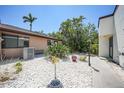 Charming single-story home featuring desert landscaping and a neutral exterior paint scheme on a sunny day at 1001 W Marion Ave # 14, Punta Gorda, FL 33950