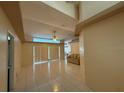 Bright living room with tile flooring, a ceiling fan, and a comfortable couch at 269 Rosemary St, Port Charlotte, FL 33954