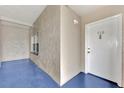 Condominium front entrance with white door, unit number 116, and view of the window at 3100 Harbor Blvd # 116, Port Charlotte, FL 33952