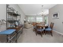 Bright dining area with wood table and chairs at 255 W End Dr # 3211, Punta Gorda, FL 33950