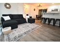 Modern living room with a sectional sofa and a large area rug at 21938 Catherine Ave, Port Charlotte, FL 33952