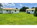 Large backyard with detached shed and grassy area at 512 Chamber Nw St, Port Charlotte, FL 33948
