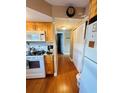 Kitchen with light wood cabinets, featuring an eat-in area at 7739 38Th N Pl, St Petersburg, FL 33709