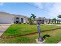 Seahorse mailbox in front of white house at 609 Macedonia Dr, Punta Gorda, FL 33950