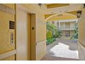 Building hallway with elevator and courtyard view at 255 W End Dr # 2201, Punta Gorda, FL 33950