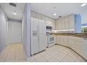 Kitchen with white cabinets, granite countertops, and stainless steel appliances at 255 W End Dr # 2201, Punta Gorda, FL 33950