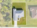 Single-story home with a large grassy backyard at 9461 Attica Cir, Port Charlotte, FL 33981