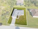 Single-story house situated on a large lot at 9461 Attica Cir, Port Charlotte, FL 33981
