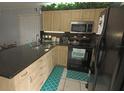 Updated kitchen with granite countertops and stainless steel appliances at 26485 Rampart Blvd # D6, Punta Gorda, FL 33983