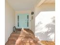 Inviting entryway with light teal door and tiled steps at 729 Macedonia Dr, Punta Gorda, FL 33950