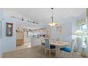 Open concept dining room with kitchen and breakfast bar views at 1355 Hempstead Ave, North Port, FL 34286