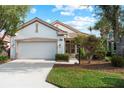 Single story home with attached garage and manicured lawn at 3239 Osprey Ln, Port Charlotte, FL 33953