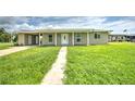 Front view of a renovated single story home at 1638 Harmony Dr, Port Charlotte, FL 33952