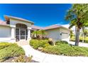 Charming single-Gathering home with manicured landscaping and a welcoming entryway at 16407 San Edmundo Rd, Punta Gorda, FL 33955