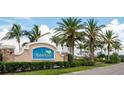 Waterford community entrance sign with palm trees at 25168 E Lenox Cir, Punta Gorda, FL 33950