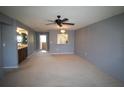 Spacious living room with neutral walls and carpeting at 255 Mission S Trl # J, Venice, FL 34285