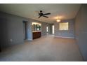 Spacious living room with neutral walls and carpeting at 255 Mission S Trl # J, Venice, FL 34285