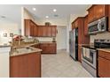 A well-equipped kitchen with stainless steel appliances, granite countertops, and ample cabinet space at 13064 Creekside Ln, Port Charlotte, FL 33953