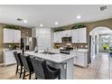 Modern kitchen featuring white cabinets and an island at 1817 W Price Blvd, North Port, FL 34286