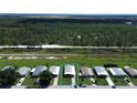 Aerial view of mobile home community, highlighting property location at 743 Tangerine Woods Blvd, Englewood, FL 34223
