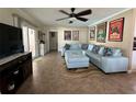 Bright and airy living room featuring a comfy sectional sofa at 829 Pineland Ave, Venice, FL 34285