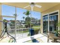 Bright screened porch with patio furniture and pool view at 2002 Bal Harbor Blvd # 312, Punta Gorda, FL 33950