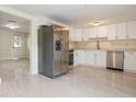 Modern kitchen with stainless steel appliances and white cabinets at 2624 Lee St, Punta Gorda, FL 33950