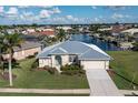 Single-story home with metal roof; located on a canal with water access at 3730 Turtle Dove Blvd, Punta Gorda, FL 33950