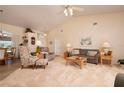 Bright living room with vaulted ceiling, comfy seating, and ample natural light at 3730 Turtle Dove Blvd, Punta Gorda, FL 33950