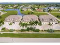 Aerial view of four townhouses with private parking at 17084 Acapulco Rd # 222, Punta Gorda, FL 33955