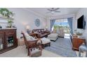 Spacious living room with leather couch and water views at 3228 Purple Martin Dr # 113, Punta Gorda, FL 33950