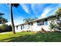 Side view of a house showcasing its landscaping and curb appeal at 8362 Osprey Rd, Englewood, FL 34224